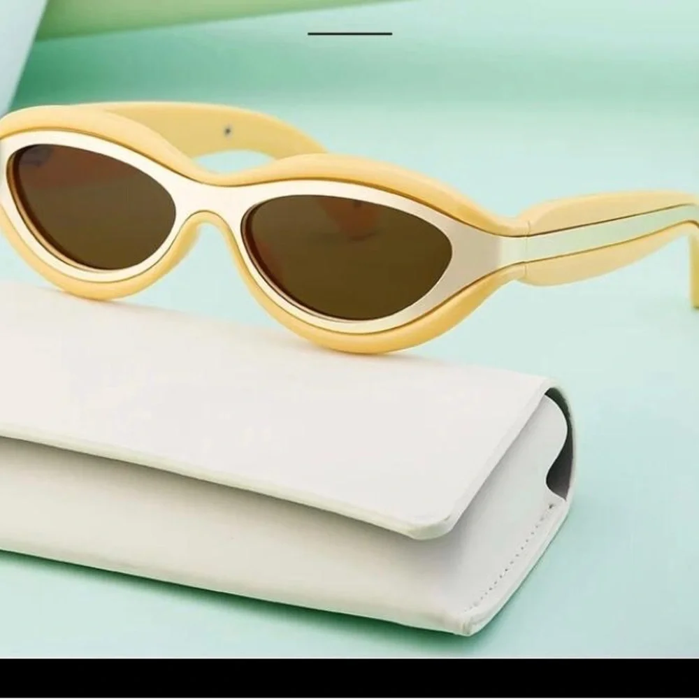 Luxury futuristic cat eye oval mustard pastel yellow steampunk sunglasses